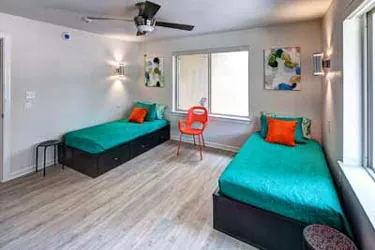A twin-bed patient room at the Briarwood detox center in Austin