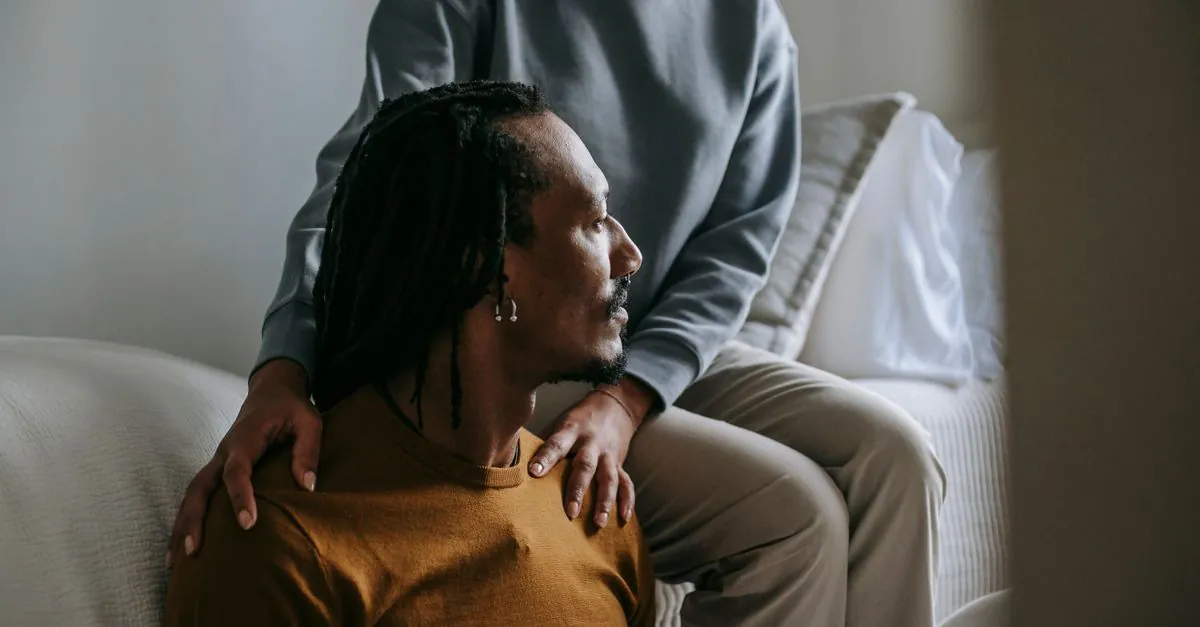 Young black couple spend time in casual outfit with sad face in room in daytime